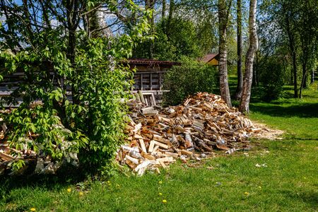 pile of fireplace log wood in open air in countrysideの写真素材