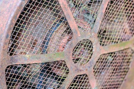 vintage retro tractor rusty details close up. gearbox, levers, viring and mechanical arms with rust...