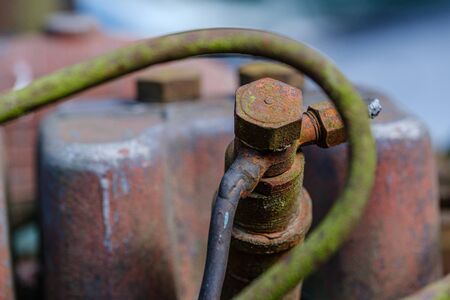 vintage retro tractor rusty details close up. gearbox, levers, viring and mechanical arms with rust...