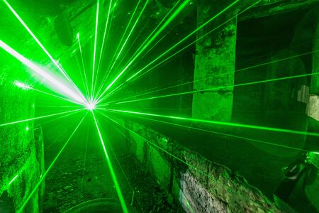 light painting lasers in abandoned room with concrete wallsの写真素材