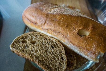 dry bread loaf on the table. old foodの写真素材