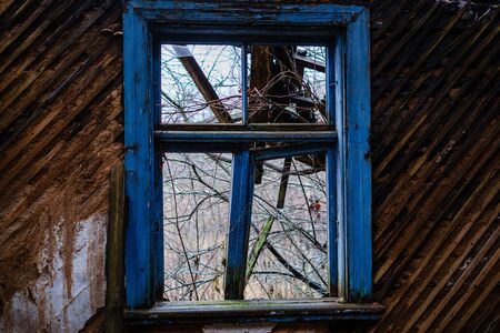 old abandoned house interior with broken furniture and empty windows. woodwork details in dustの写真素材