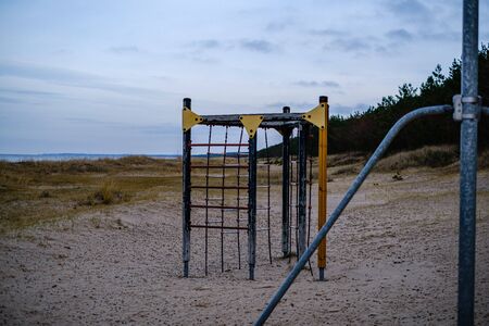 beach sand texture with water with childrens playground.の写真素材