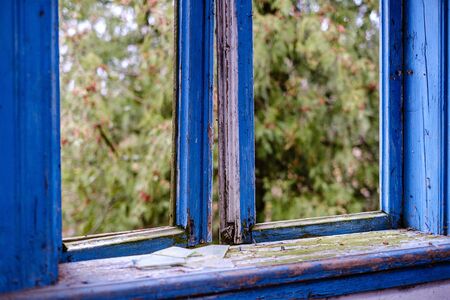 old abandoned house interior with broken furniture and empty windows. woodwork details in dustの写真素材