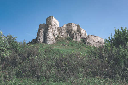 ruins of old abandoned castle on the cliff with bricks and stone. architecture details in Slovakia - vintage retro lookのeditorial素材