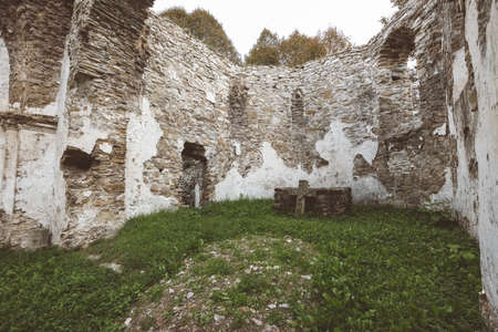 ruins of old abandoned church with red bricks and stone in early autumn in Slovakia - vintage retro lookのeditorial素材