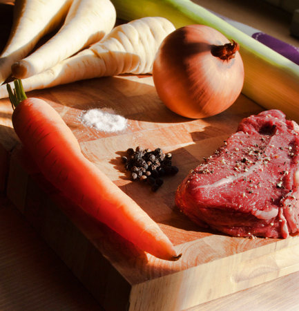 A selection of root vegetables and skirt steak ready for Winter stewの写真素材