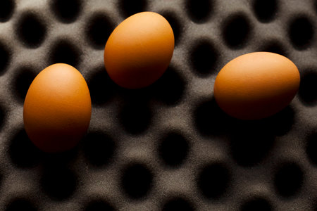 Three organic eggs on custom base.