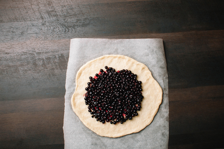 Homemade galette pie. The process of making the cake. Delicious dessert. Black currant cake. Homemade recipeの写真素材
