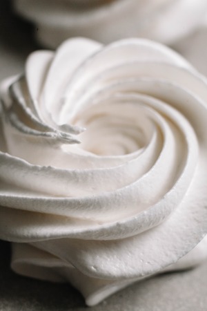 Airy white marshmallow close-up on parchment background. The recipe for making marshmallow.の写真素材