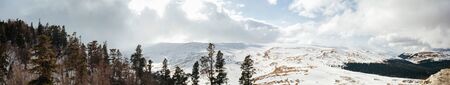Caucasian late autumn mountain landscape Lago-Naki plateau. Panorama with snowy hillsの写真素材