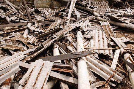 Dilapidated building with reinforced concrete columns and broken slate. Ruins of a buildingの写真素材