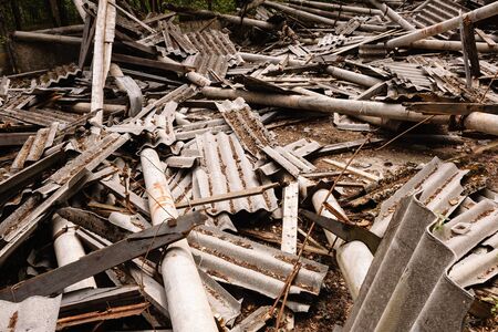 Dilapidated building with reinforced concrete columns and broken slate. Ruins of a buildingの写真素材