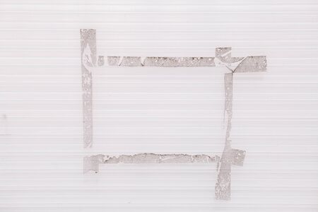 White dirty plastic background with stripes and dirt particles after pasting with advertisementsの写真素材