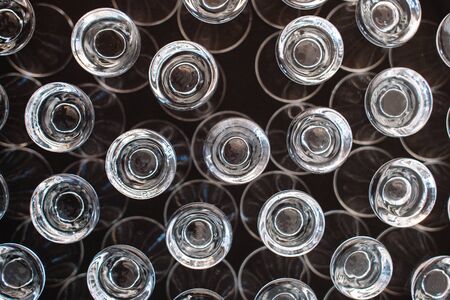 Wine glasses are stored in an inverted manner within the compartments of a portable polypropylene crate shown in top view. It can be transported to and from events and functions safely and securely.の写真素材