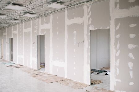 Drywall wall home interior decoration at construction site with copy space add textの写真素材
