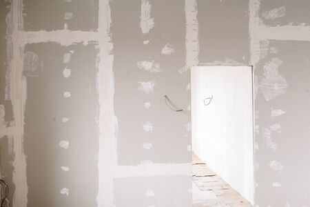 Drywall wall home interior decoration at construction site with copy space add textの写真素材