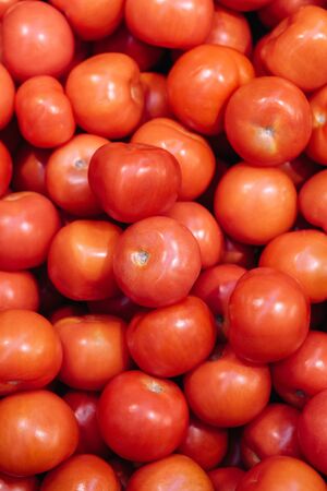 A lot of red tomatoes background. Healthy food, background for the storeの写真素材