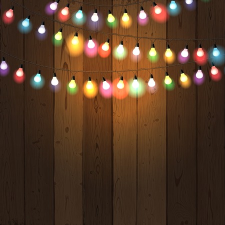 Colourful  Christmas lights on wooden backgroundのイラスト素材
