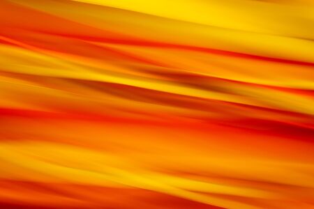 Abstract red and yellow striped background in motion blurの写真素材