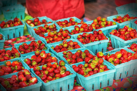 Strawberries for sale at a market stall in the city.の写真素材