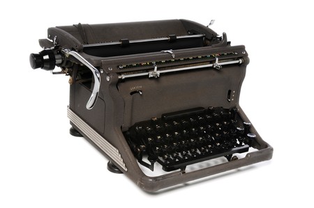 Vintage manual typerwriter isolated over a white backgroundの写真素材
