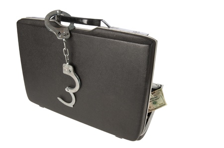Hard-shell briefcase with stack of $20 U.S. bills visisble, handcuffs on the handle, isolated on a white backgroundの写真素材