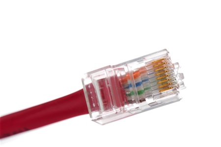 Closeup of CAT 5 computer networking cable isolated on white, selective focus on gold contactsの写真素材