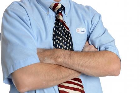 Patriotic voter wearing a U S  flag tie and dress shirt sports an  I voted  stickerの写真素材
