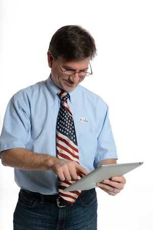 Patriotic voter wearing a U S  flag tie and dress shirt sports an  I voted  stickerの写真素材