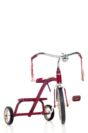 Red child's tricycle on a white の写真素材