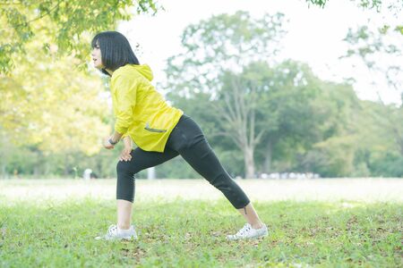 a woman exercising in the parkの写真素材