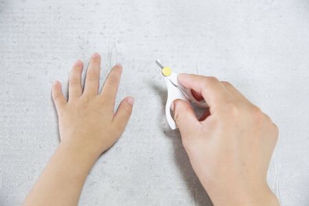 cut a child's clawsの写真素材