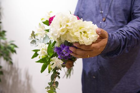 Husband sending flowers to wifeの写真素材
