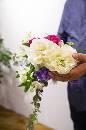 Husband sending flowers to wifeの写真素材