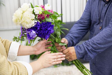 Husband sending flowers to wifeの写真素材