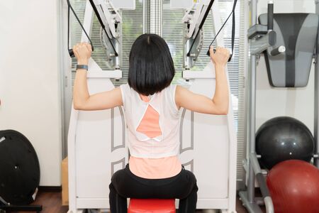 A woman exercising in the gymの写真素材