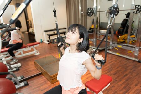 A woman exercising in the gymの写真素材