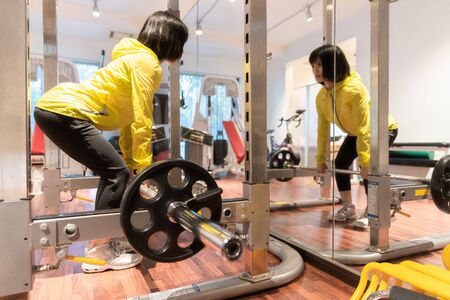 A woman exercising in the gymの写真素材