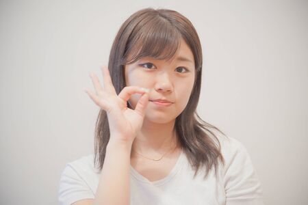 the OK sign womanの写真素材