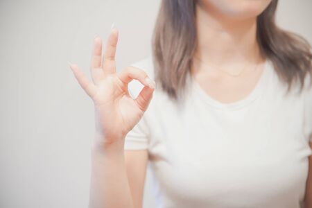 the OK sign womanの写真素材