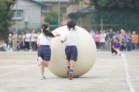 Elementary school athletic meet, large ball rollingの写真素材