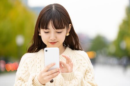 Young Woman Using Smartphoneの写真素材