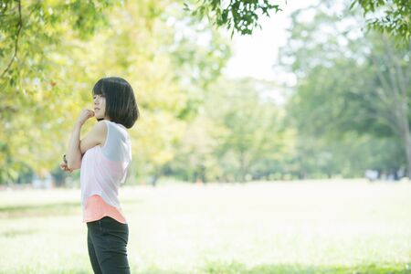 A Woman Exercising in the Parkの写真素材