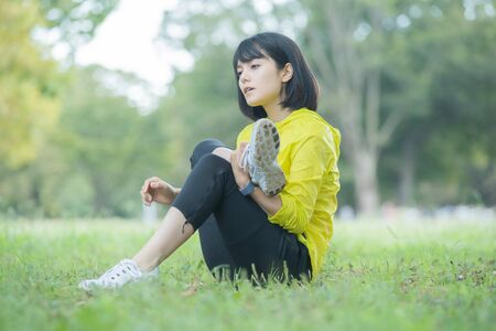 a woman exercising in the parkの写真素材