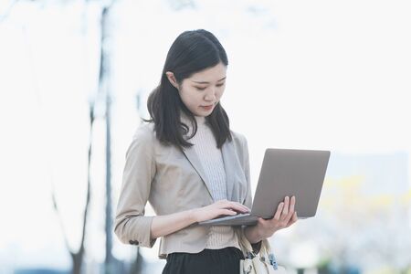 Businesswoman touching a laptopの写真素材