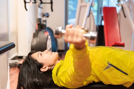 A woman exercising in the gym