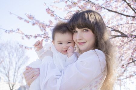 Baby, Mother and Cherry Treeの写真素材
