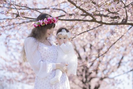 Baby, Mother and Cherry Treeの写真素材