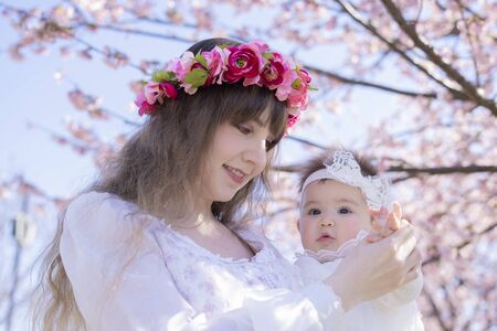 Baby, Mother and Cherry Treeの写真素材